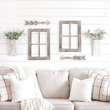 Decorative wooden window frame with arrows